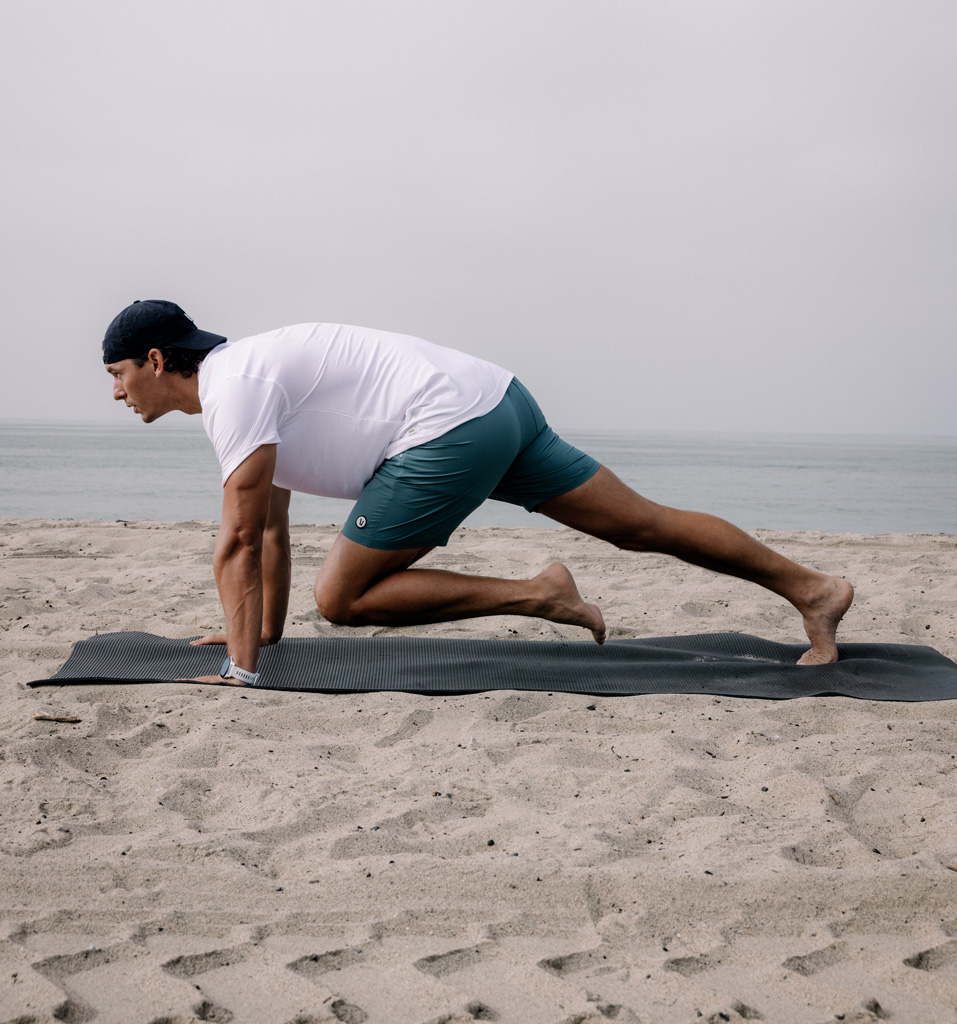 The coach is working out in the beach.
